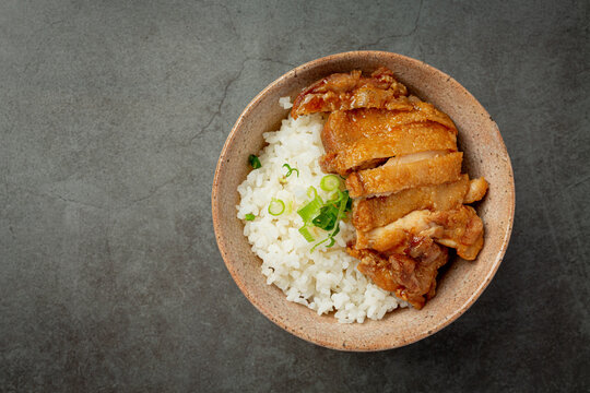 Toriyaki chicken on dark background