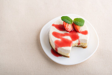 Classic dessert. Fruit cheesecake, with fresh strawberries and berry juice.