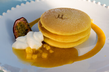 Pancake with mango and cream