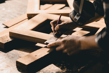 The carpenters high experienced wood worker making furniture. master of woodcraft male work with...