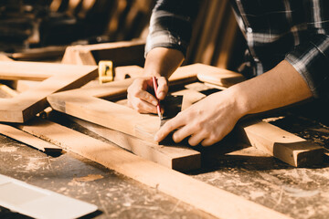 The carpenters high experienced wood worker making furniture. master of woodcraft male work with...