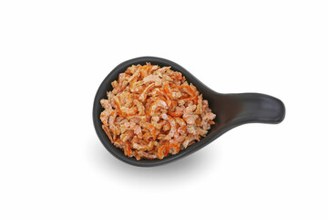 Small dried shrimp on a black cup with isolated white background.