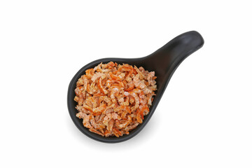 Small dried shrimp on a black cup with isolated white background.