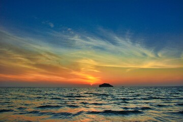 Beautiful sunset over an island, seaside