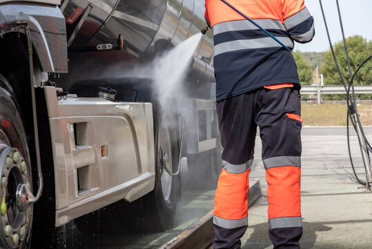 Tank Truck Driver Cleaning The Exterior Of The Vehicle.