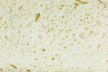 Loaf of white bread inside texture background. Bakery concept. Close up, macro photo.
