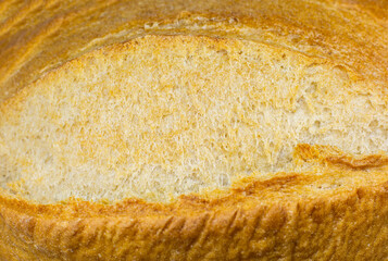 Roasted Bread texture background. Loaf Bakery concept. Close up, macro photo. Beautiful natural...