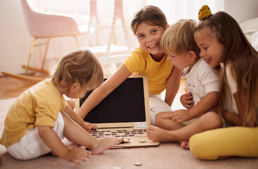 Group of kids playing interactive games.