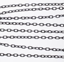 Set. Collection of various metal chains on a white background