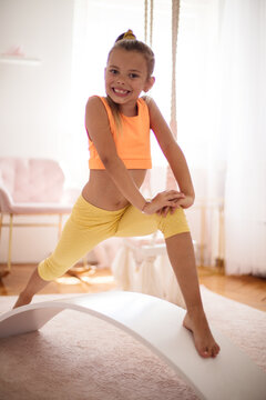 Little girl stretching.