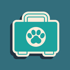 Green Pet first aid kit icon isolated on green background. Dog or cat paw print. Clinic box. Long shadow style. Vector