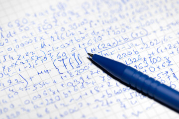 Math handwriting in notebook closeup