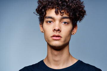 cute guy with curly hair cropped view isolated background studio