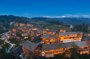 Fototapeta premium Night view of Qianhu Miao village in Xijiang, Qiandongnan, Guizhou Province, China