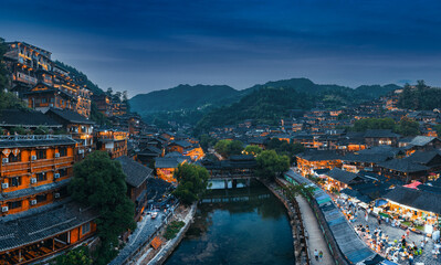 Night view of Qianhu Miao village in Xijiang, Qiandongnan, Guizhou Province, China