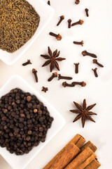spices in ceramic bowls and white background stock photo