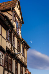 View of historical houses with the moon in  Quedlinburg, Germany