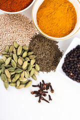  spices in ceramic bowls and on white background stock photo