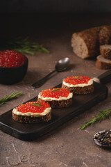 Sandwiches with butter and red caviar 