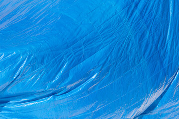 Blue plastic tarpaulin canvas background.