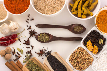 Wooden spoon with mixed spices top view stock photo