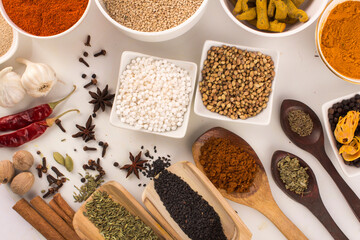 Wooden spoon with mixed spices top view stock photo