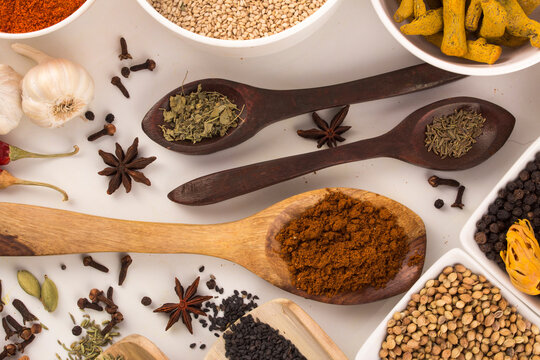 Wooden spoon with mixed spices top view stock photo
