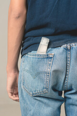 Men's jeans back pocket for a mask during the coronavirus epidemic.