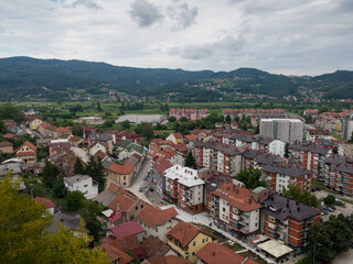 Fototapeta na wymiar Aerial view of Doboj and hilly countryside from medieval fortress Gradina during overcast summer day.