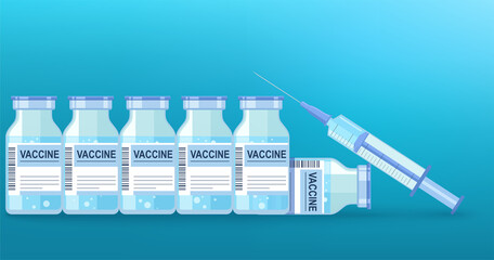 Medical disposable syringe with needle and vials of vaccines against virus on blue background.
