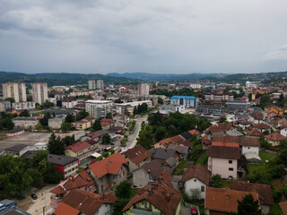 Aerial view of Doboj downtown from medieval fortress Gradina during overcast summer day.