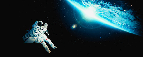 Astronaut spaceman do spacewalk while working for space station in outer space . Astronaut wear full spacesuit for space operation . Elements of this image furnished by NASA space astronaut photos. © InfiniteFlow
