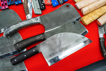 Carving knives for meat. Ax knife in assortment on the counter in the store. Close-up