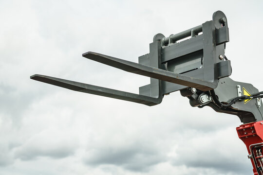 Forklift industrial loader or stacker against sky.