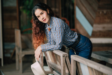 Beautiful Asian women wear blue plaid shirts