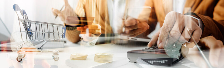 businesswoman hand using smart phone, tablet payments and holding credit card online shopping, omni channel, digital tablet docking keyboard computer at office in sun light