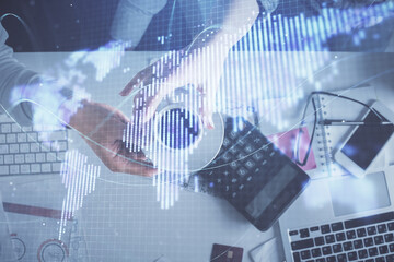 Double exposure of man and woman working together and business theme hologram drawing. Computer background. Top View.