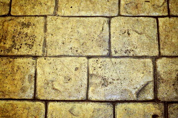 A fragment of the textured floor with bricks