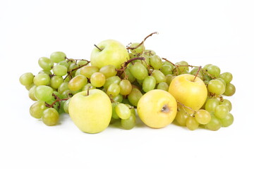 Still life with grapes and apples on a white background