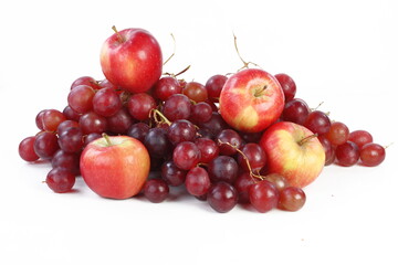 Still life with grapes and apples on a white background