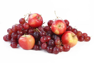 Still life with grapes and apples on a white background