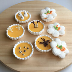 Meringue baskets with lemon curd on a wooden board. Halloween party