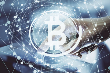 Double exposure of man's hands holding and using a phone and crypto currency blockchain theme drawing.