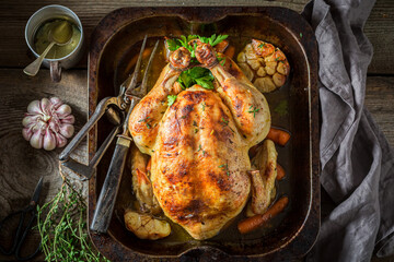 Grilled chicken with spices and vegetables. Roasted chicken with herbs.