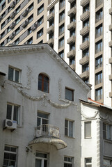 background and texture from the cityscape, densely built-up city dmmas, the sky is not visible through the high-rise buildings. perspective of streets and houses