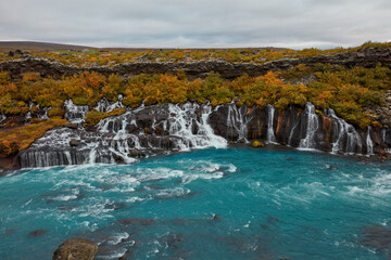 Unusual blue waterfall in Iceland Hraunfossar