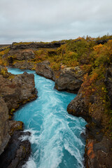 Unusual blue waterfall in Iceland Hraunfossar