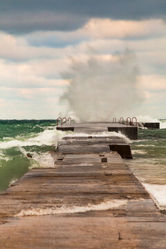 Powerful Crashing Waves Of Lake Michigan Overpowering A Jetty