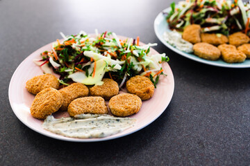vegan nuggets with shredded salad and dairy-free sauces, healthy plant-based food