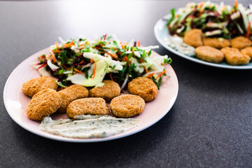 vegan nuggets with shredded salad and dairy-free sauces, healthy plant-based food